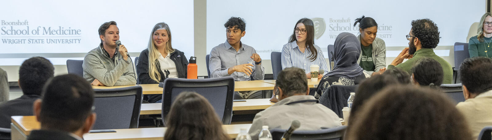 photo of students leading a group discussion