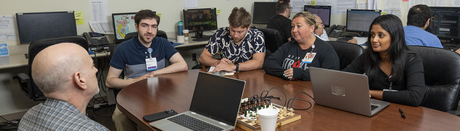 photo of students and a professor sitting at a table