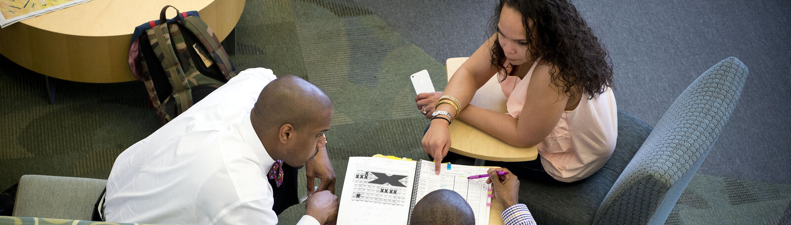 photo of students studying in white hall