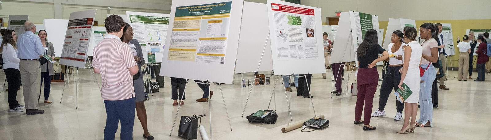 photo of students at a research poster session