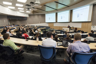 photo of students and an instructor in a lecture hall