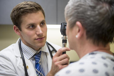 photo of a medical student and patient